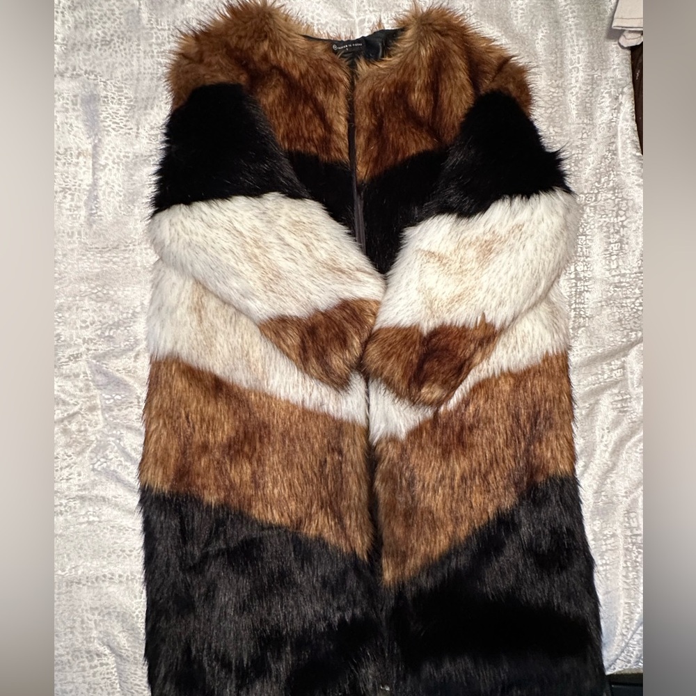 Hot! New faux fur multi color coat. Never worn before.